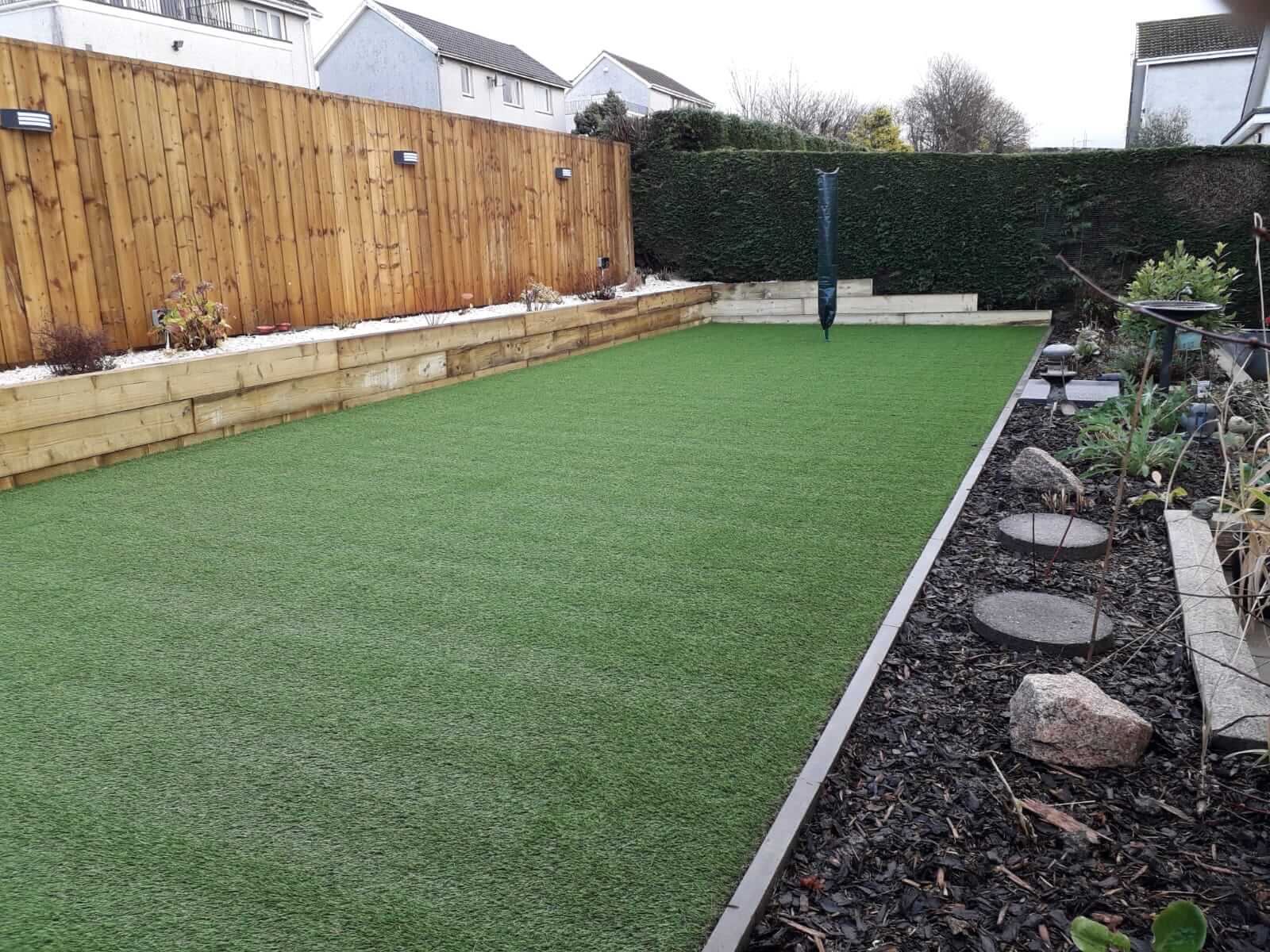 Garden project, laid AstroTurf, sleepers and paving