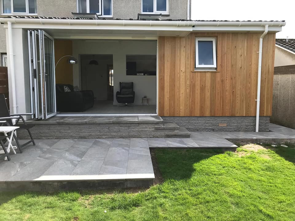 This extension compliments their existing property to add a utility, toilet, kitchen and living room, complete with bi-fold doors, velux and exterior larch cladding. We finished the project with the ground work to include laying of slabs and patio area.