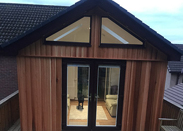 Sunroom extension - Cedar Clad with uPVC Patio Doors/Windows